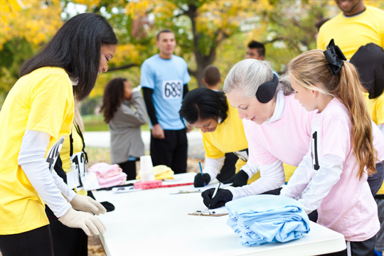 Diverse group of people signing up at charity run/walk event